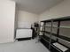 Storage area with shelving and water heater at 1075 Trappers Trail Loop, Davenport, FL 33896