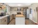 Updated kitchen with stainless steel appliances and wood-look flooring at 2350 Pleasant Dr, Longwood, FL 32779