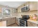 Modern kitchen with stainless steel appliances and ample counter space at 2350 Pleasant Dr, Longwood, FL 32779