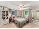 Bedroom with a queen bed and built-in shelving at 2350 Pleasant Dr, Longwood, FL 32779