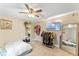 Bedroom with a full-size bed, large mirror, and walk-in closet at 2350 Pleasant Dr, Longwood, FL 32779