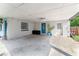 Covered carport with concrete flooring, providing parking and storage space at 2350 Pleasant Dr, Longwood, FL 32779