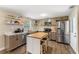 Modern kitchen featuring stainless steel appliances and an island at 2350 Pleasant Dr, Longwood, FL 32779