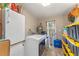 Laundry room with washer, dryer, and extra storage at 2350 Pleasant Dr, Longwood, FL 32779