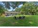 Private backyard with fire pit and plenty of green space at 2350 Pleasant Dr, Longwood, FL 32779