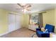 Bright bedroom with double doors and a ceiling fan at 2350 Pleasant Dr, Longwood, FL 32779