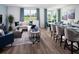 Open concept living room and kitchen with hardwood floors and stylish furniture at 3514 Rutland Ln, Haines City, FL 33844