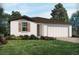 One-story house with a two-car garage and landscaping at 3514 Rutland Ln, Haines City, FL 33844