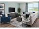Gathering room with sectional sofa and lake view at 3514 Rutland Ln, Haines City, FL 33844