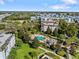 Aerial view of community pool and surrounding buildings at 7651 Whisper Way # 401, Reunion, FL 34747