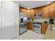 Modern kitchen with stainless steel appliances and granite countertops at 7651 Whisper Way # 401, Reunion, FL 34747