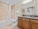 Clean bathroom with tub, shower and granite vanity at 7651 Whisper Way # 401, Reunion, FL 34747