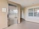 Hallway with elevator access and window at 7651 Whisper Way # 401, Reunion, FL 34747