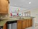 Kitchen features granite countertops, stainless steel appliances, and breakfast bar at 7651 Whisper Way # 401, Reunion, FL 34747