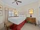 Bright bedroom with a comfortable queen-size bed and en-suite bath at 7651 Whisper Way # 401, Reunion, FL 34747