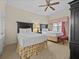Bedroom with two twin beds, and ceiling fan at 7651 Whisper Way # 401, Reunion, FL 34747