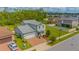 Aerial view of two-story house with a two-car garage and landscaped yard at 2048 Napoli Dr, Saint Cloud, FL 34771