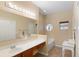 Bathroom with a vanity, bathtub, and a large mirror at 3216 Lynrock Ave, Dundee, FL 33838