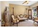 Second bedroom with antique furniture and lots of natural light at 3216 Lynrock Ave, Dundee, FL 33838
