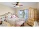 Bedroom with a queen-size bed and a matching armoire at 3216 Lynrock Ave, Dundee, FL 33838