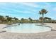 Community pool with surrounding patio and palm trees at 277 Ludisia Loop, Davenport, FL 33837
