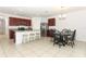 Kitchen with granite countertop island and stainless steel appliances at 277 Ludisia Loop, Davenport, FL 33837