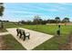 Community dog park with bench and waste disposal at 277 Ludisia Loop, Davenport, FL 33837