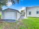 View of the house and detached garage from backyard at 700 Eldridge St, Orlando, FL 32803