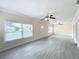 Large living room with tile floors and multiple windows at 700 Eldridge St, Orlando, FL 32803