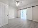 Bedroom with sliding barn doors and ceiling fan at 700 Eldridge St, Orlando, FL 32803