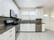 Updated kitchen, featuring white cabinets and granite countertops at 700 Eldridge St, Orlando, FL 32803