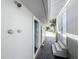 Side yard with exterior shower and access to the backyard at 700 Eldridge St, Orlando, FL 32803