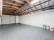 Spacious garage with overhead storage and painted floor at 700 Eldridge St, Orlando, FL 32803