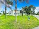 Street view of a renovated home with palm trees and a fire hydrant at 700 Eldridge St, Orlando, FL 32803