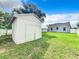 View of the backyard with detached garage and home at 700 Eldridge St, Orlando, FL 32803