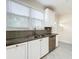 Well-equipped kitchen with white cabinets and granite countertops at 700 Eldridge St, Orlando, FL 32803