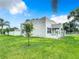 Exterior view of a renovated home with a grassy yard at 700 Eldridge St, Orlando, FL 32803