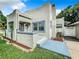 Updated home exterior with landscaped yard and new walkway at 700 Eldridge St, Orlando, FL 32803