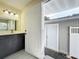 Updated bathroom with dark vanity and access to backyard at 700 Eldridge St, Orlando, FL 32803