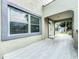 Covered front porch with new tile flooring and door at 700 Eldridge St, Orlando, FL 32803