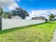 Backyard with a white vinyl fence, grassy area, and shed at 700 Eldridge St, Orlando, FL 32803