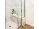 Walk-in shower with marble tile and built in bench at 886 Grazie Loop, Davenport, FL 33837