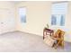 Spacious bedroom with neutral colors, carpet, and two windows at 886 Grazie Loop, Davenport, FL 33837