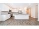 Open concept kitchen with stainless steel appliances and island at 886 Grazie Loop, Davenport, FL 33837