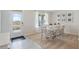 Dining area with table and chairs, and access to front entry and window at 3746 Bluethread Way, Poinciana, FL 34759