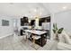 Open kitchen with island, stainless steel appliances, and dark cabinets at 2599 Nouveau Way, Kissimmee, FL 34741