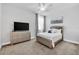 Guest bedroom with a queen-size bed and dresser at 2599 Nouveau Way, Kissimmee, FL 34741