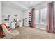 Bright vanity area with a white desk, comfortable chair, and ample storage at 2599 Nouveau Way, Kissimmee, FL 34741