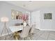 Bright dining area with modern gold and white dining set at 2599 Nouveau Way, Kissimmee, FL 34741