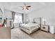 Main bedroom with a king-size bed and ceiling fan at 2599 Nouveau Way, Kissimmee, FL 34741
